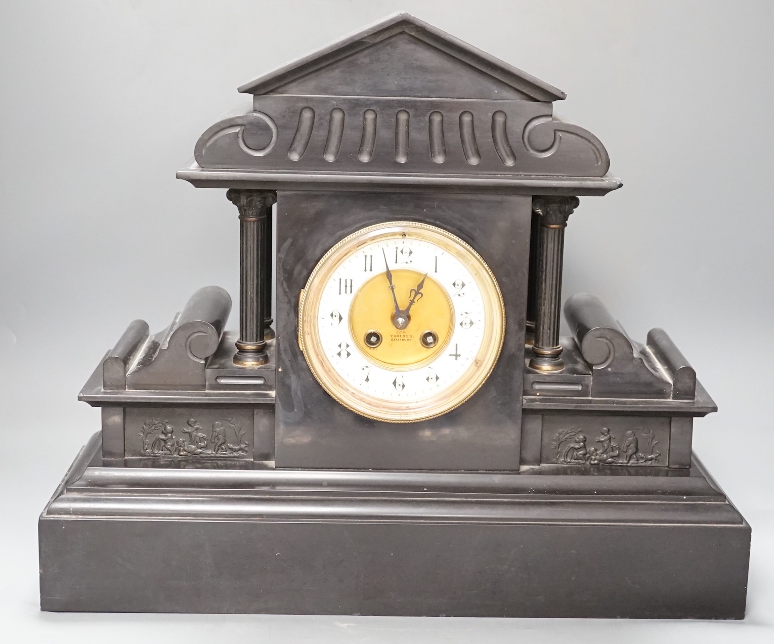 A large Victorian black slate mantel clock, with pendulum - 39cm high